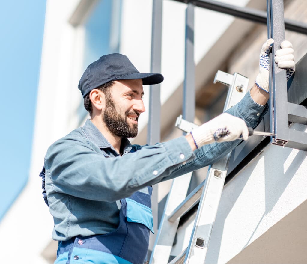 Builder mounting balcony fence